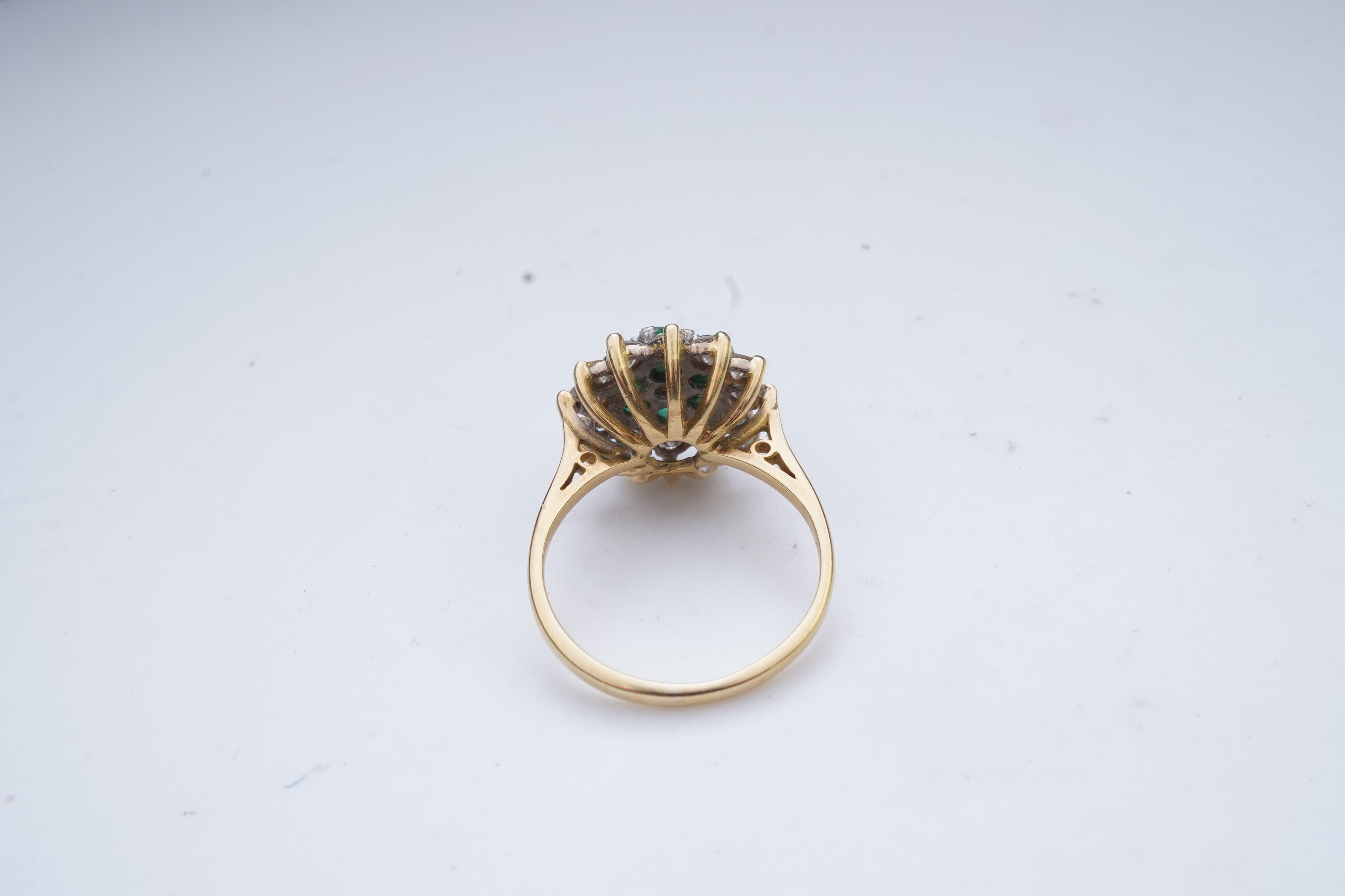 An emerald and diamond ring